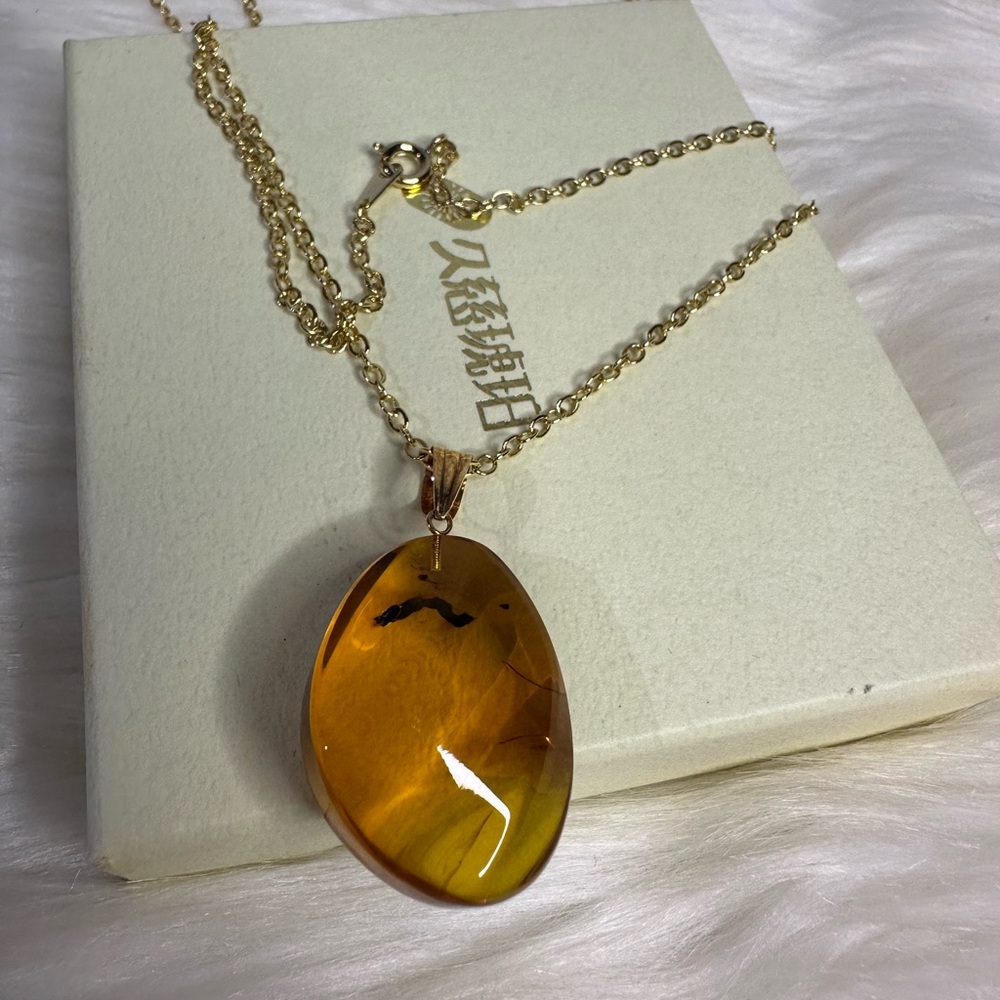 AMBER necklace in 18k gold and plated chain - Picture 8 of 17